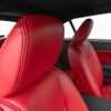 Installed leather headrest closeup with contrasting Black double-stitching