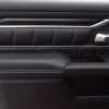 Flat on view of Black leather door armrest upholstery installed