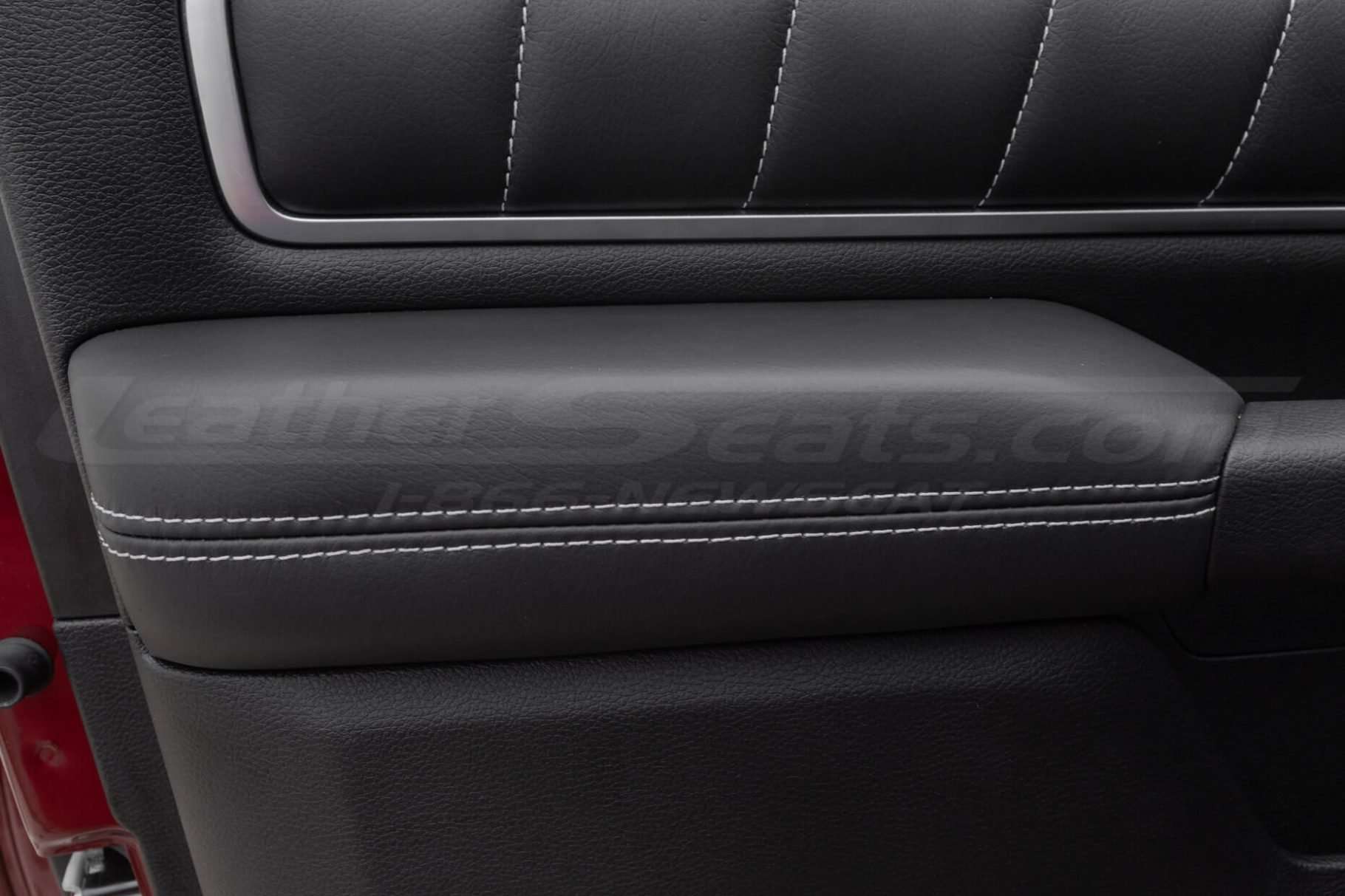 Front view of installed door armrest upholstery