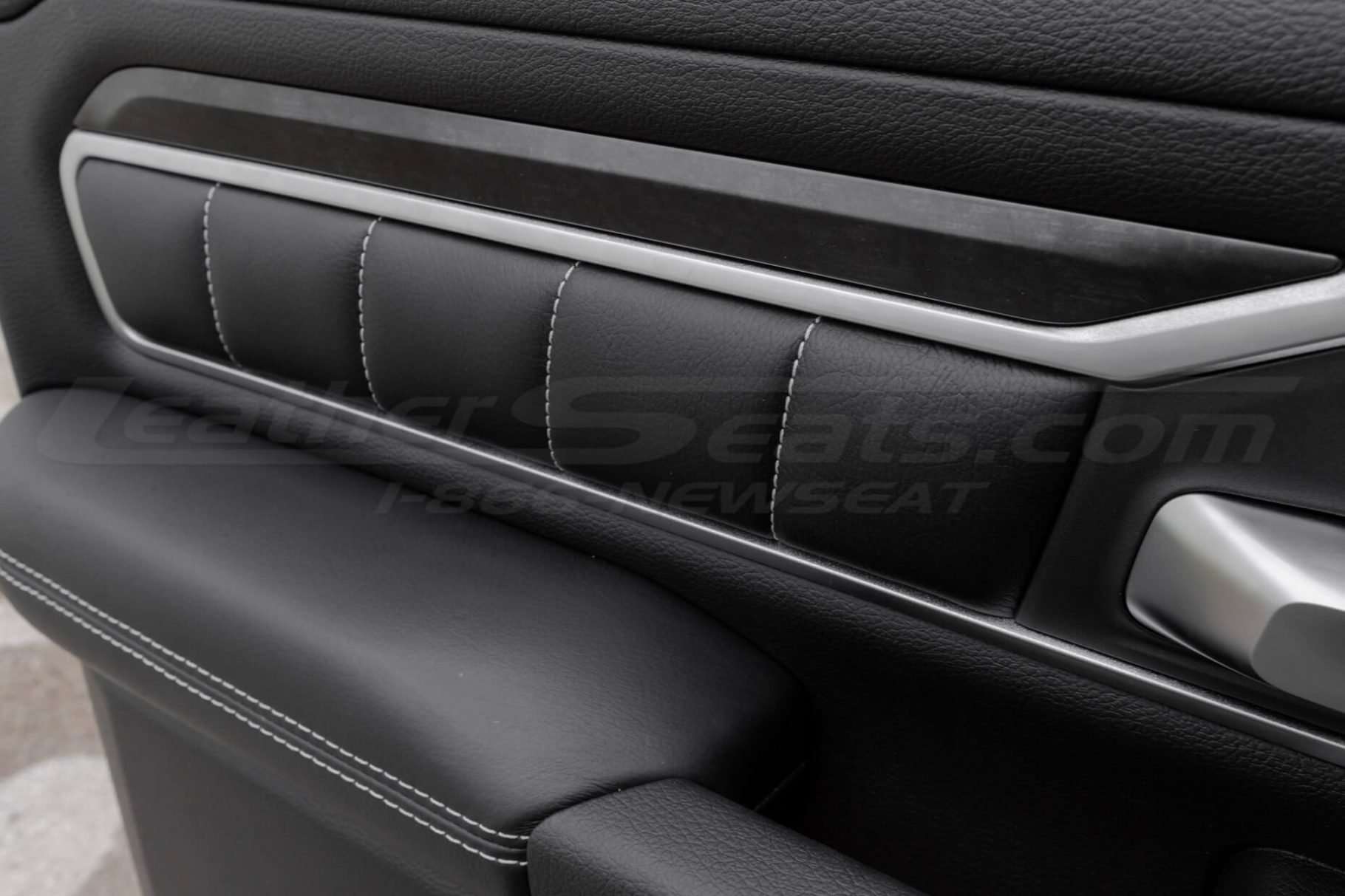 Quilted Door panel inserts on Black leather with white stitching