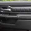 Passenger door with installed door panel inserts and armrests
