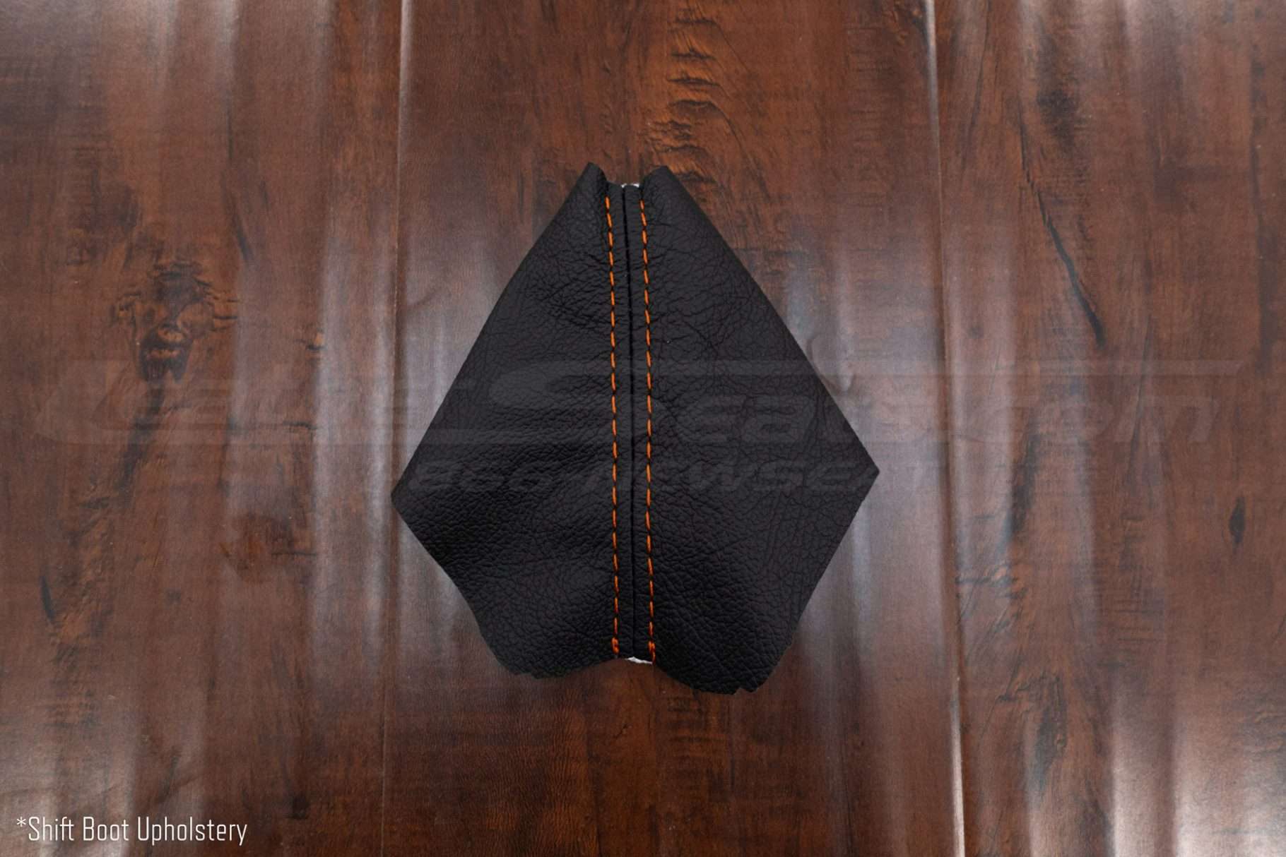 Leather shift boot upholstery in black leather and orange stitching