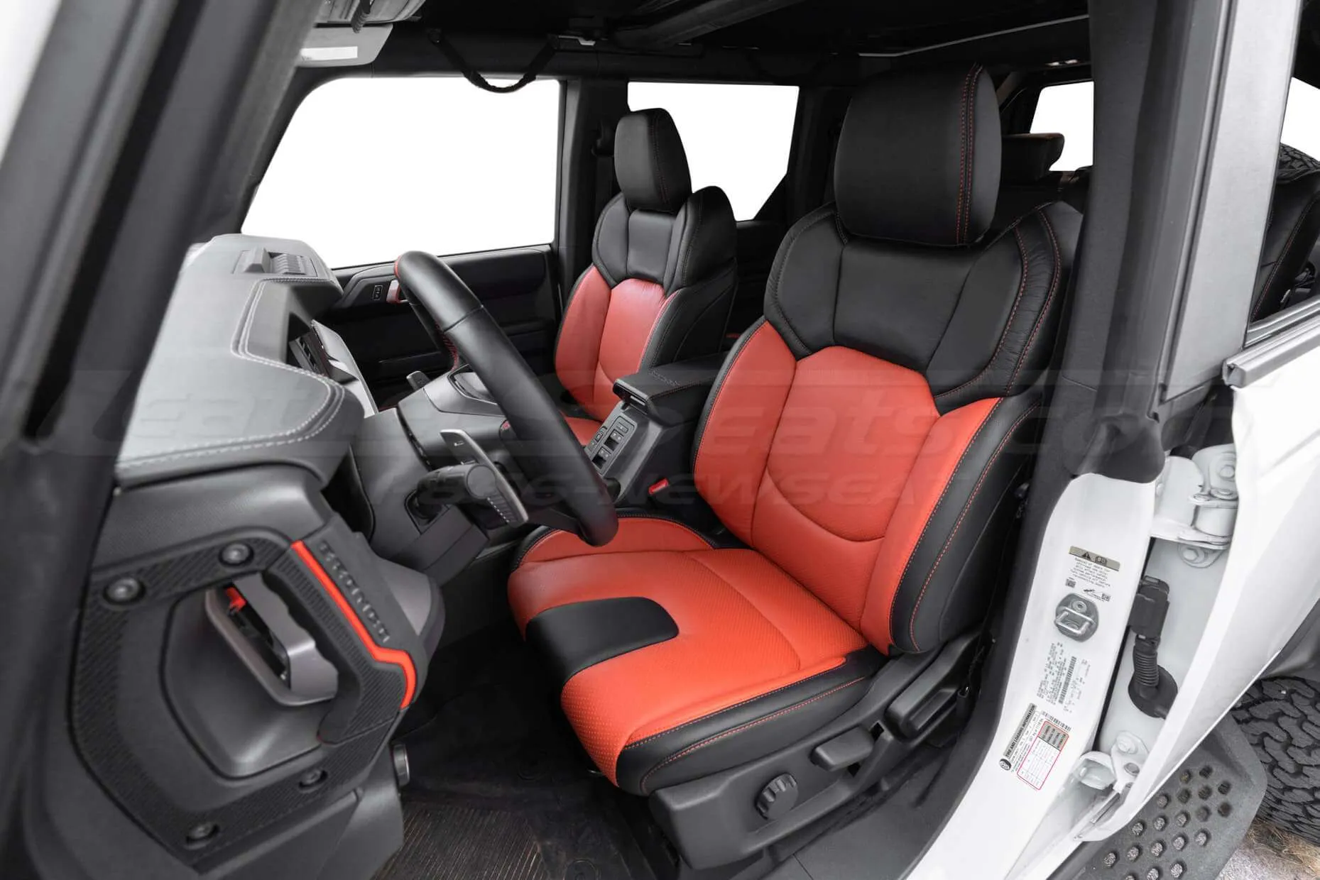 Custom Two-Tone Black and Tangerine leather seats with perforated inserts for 2023 Ford Bronco Raptor