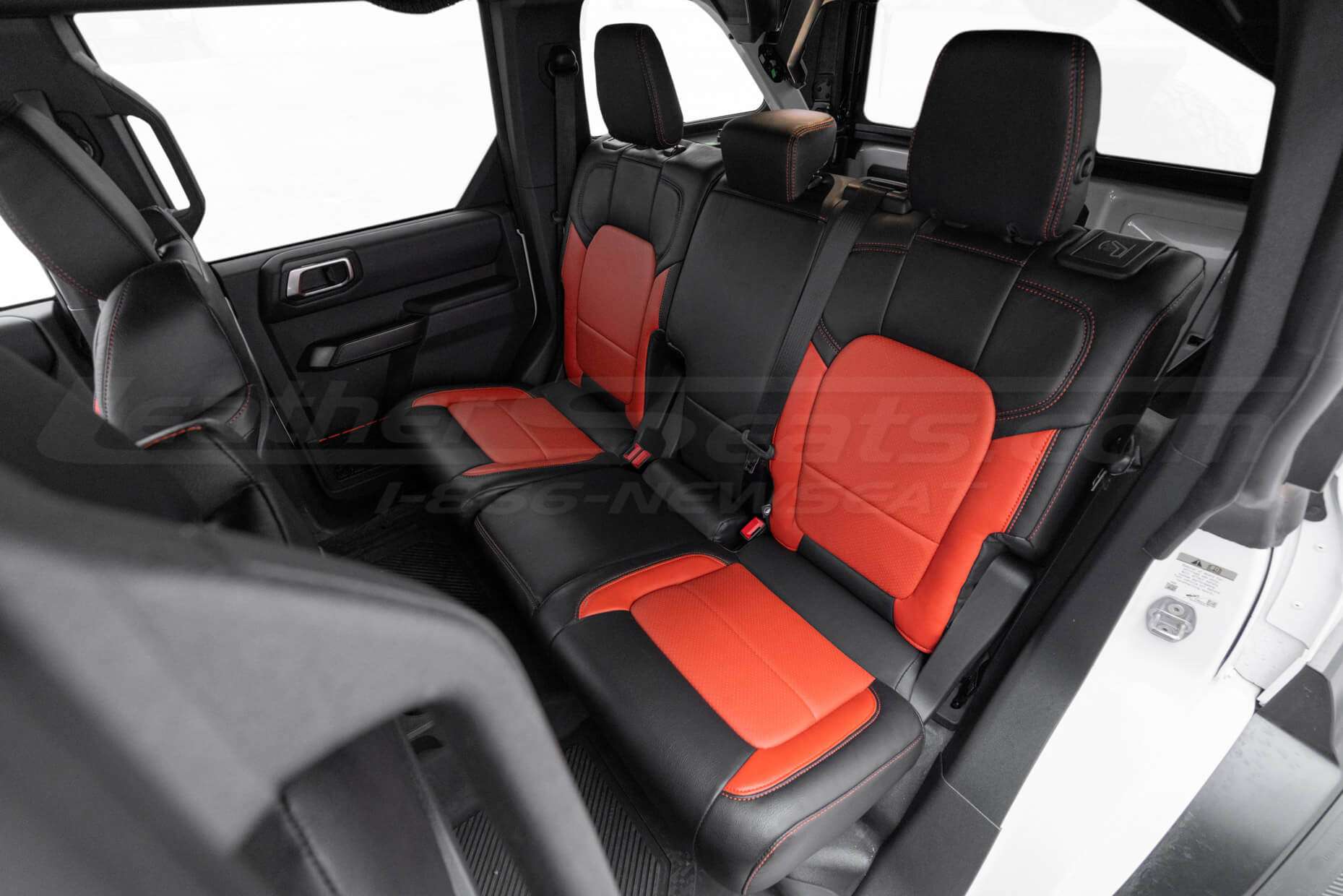 Driver side view of rear seats with custom installed leather kit