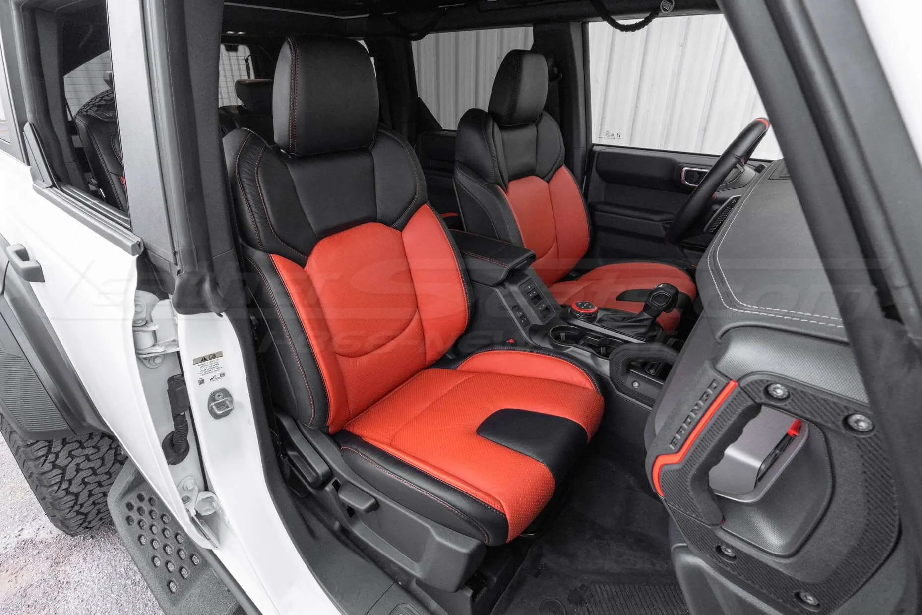 Bronco Raptor with custom Black and Tangerine Interior - Front passenger
