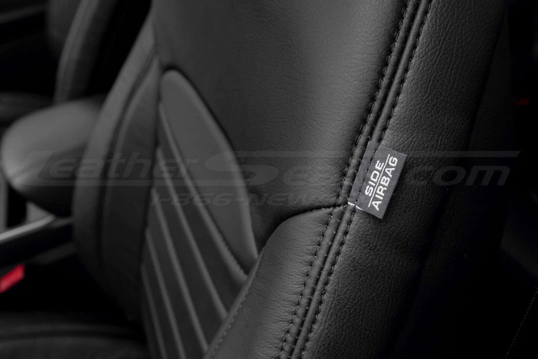 Black stitching on Black leather with side airbag tag