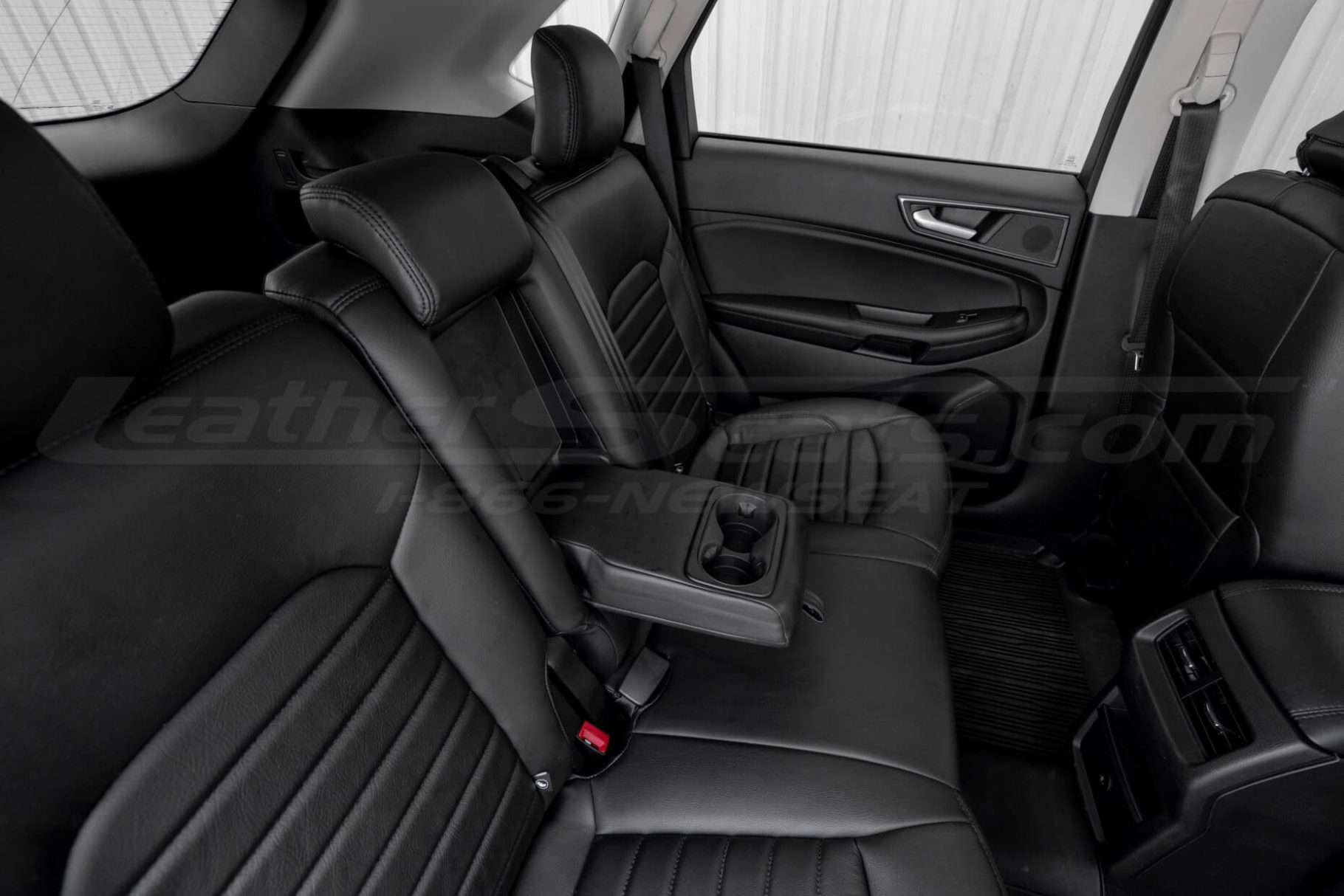 Leather rear armrest/cup holder