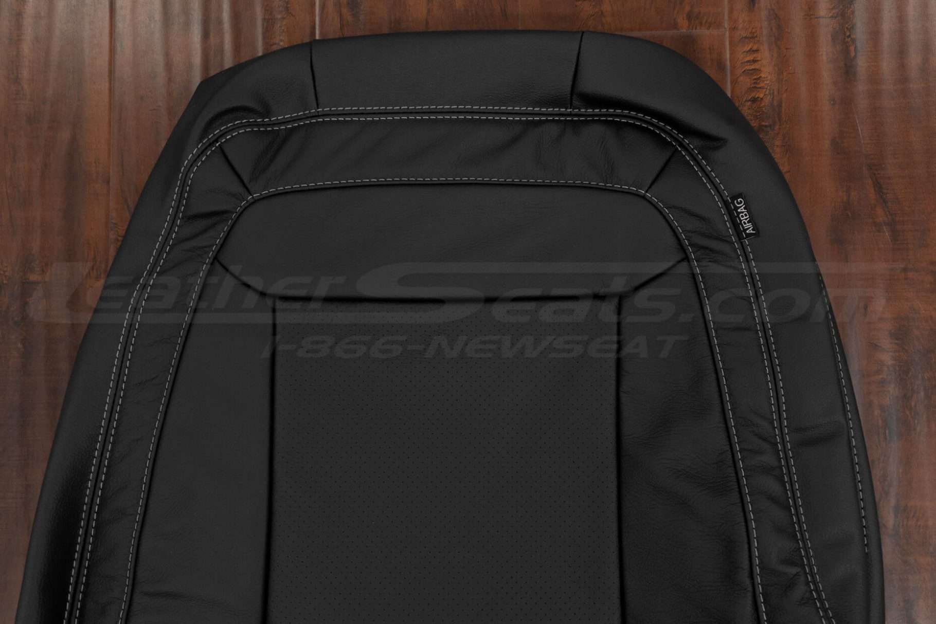 Upper section of front backrest upholstery