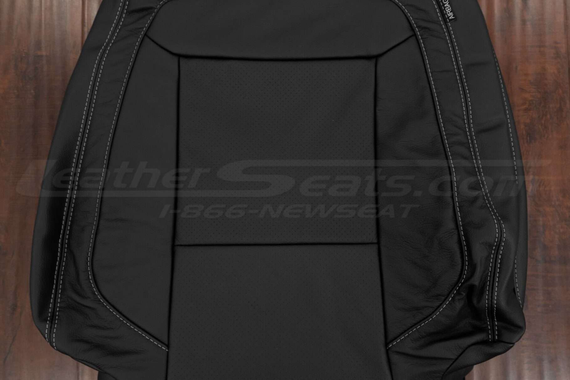 Perforated insert section of Ford Explorer backrest upholstery