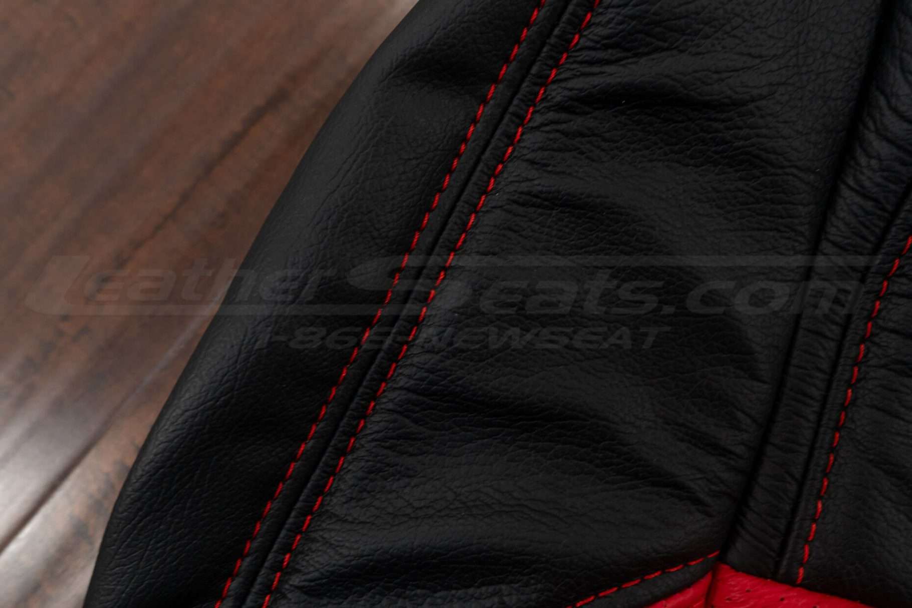 Bright Red double-stitching on Black leather
