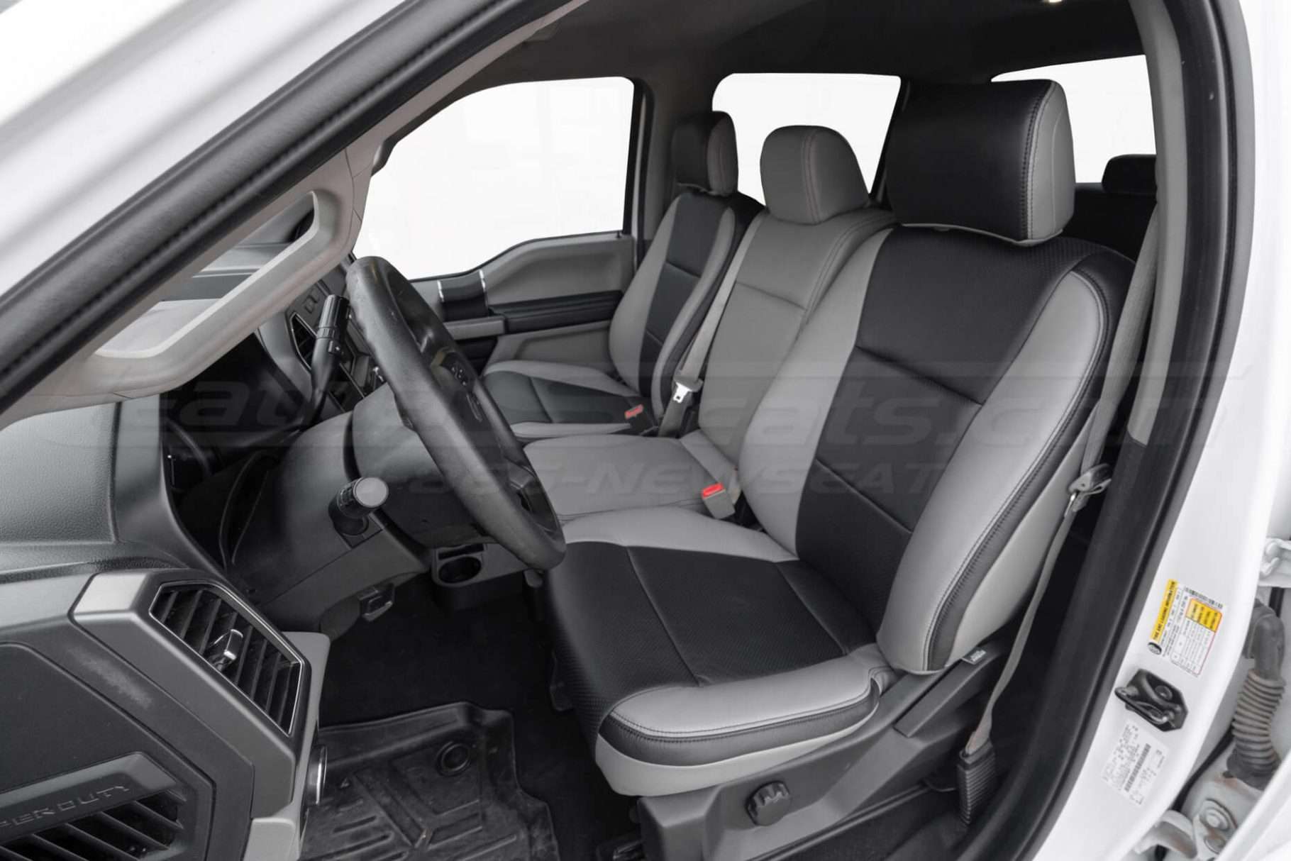 Alternative view of front driver leather seat with jump seat in seating position