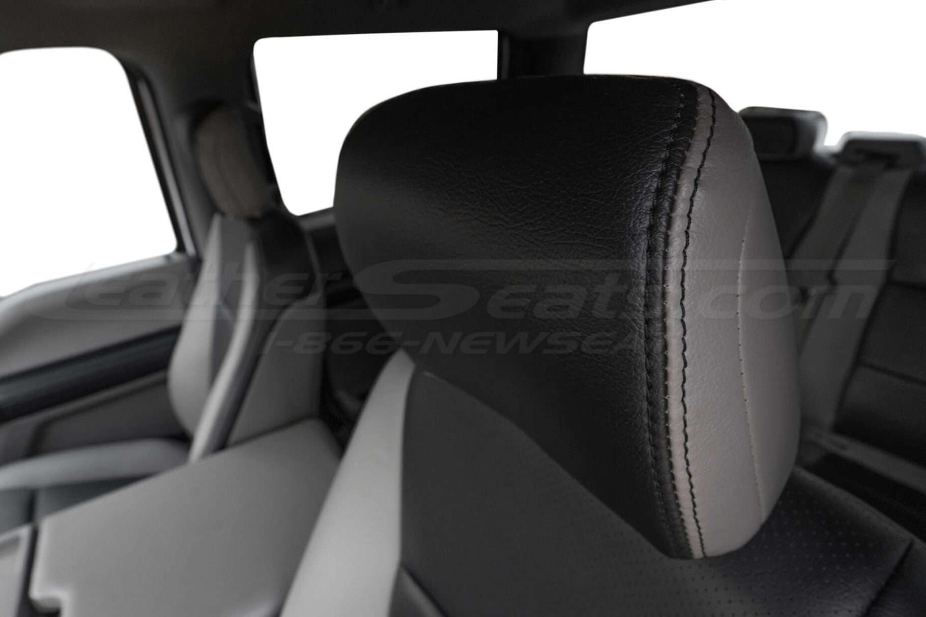 Leather headrest close-up with Black double-stitching
