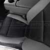 Top-down view of front driver seat showing leather texture and Black perforated body sections