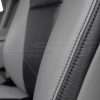 Black double-stitching on Stone leather and Black wing poretion of upholstery