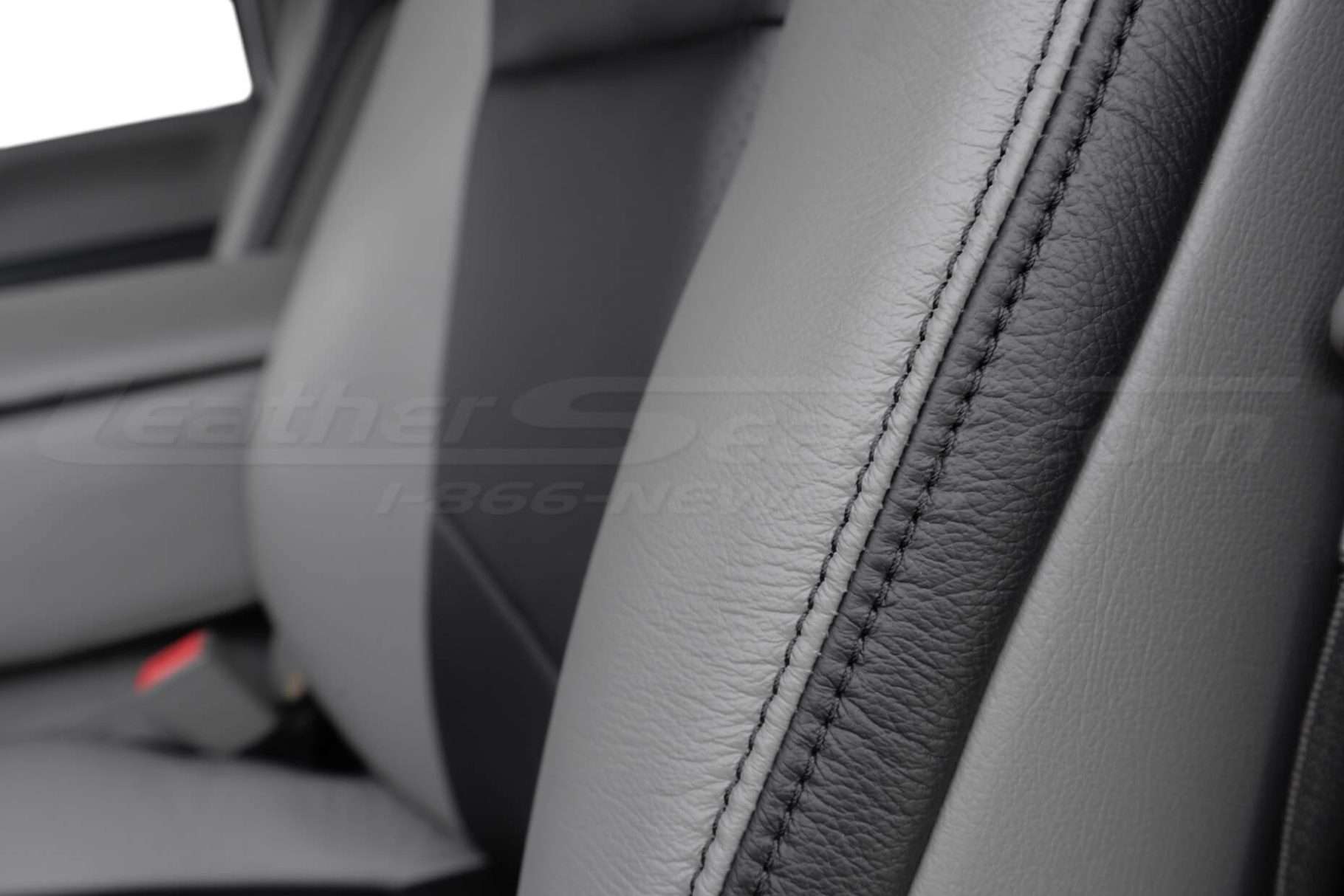 Black double-stitching on Stone leather and Black wing poretion of upholstery
