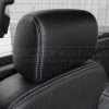 Leather headrest close-up with contrasting silver stitching