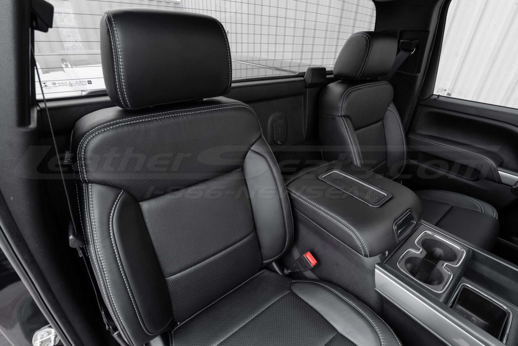 Front backrest and headrest section of installed passenger leater seat