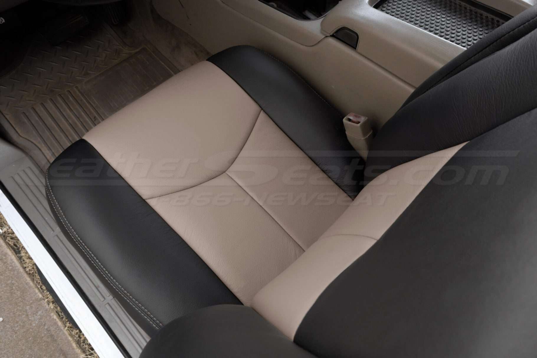 Top-down view of front leather seat showing black & desert colored leather