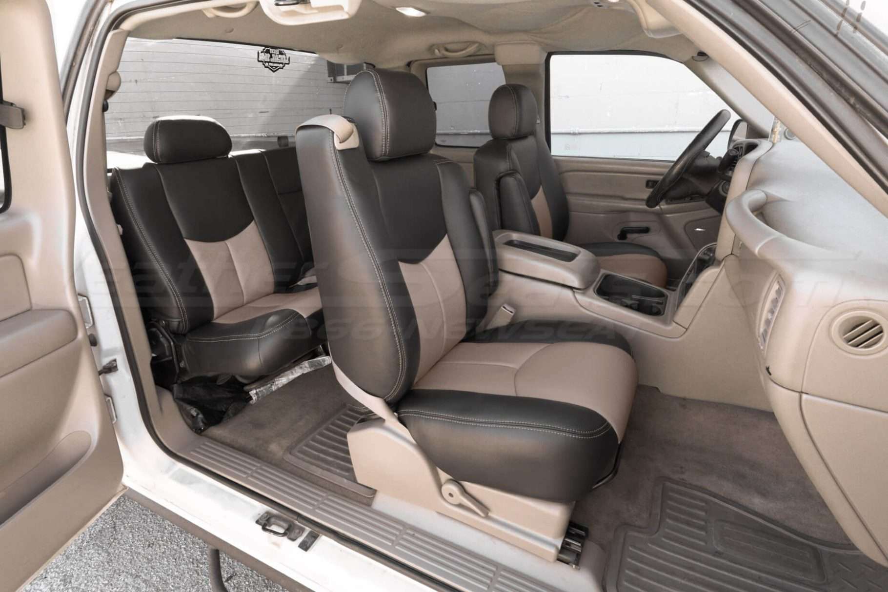 Wide view of front and rear seat installed leather seats