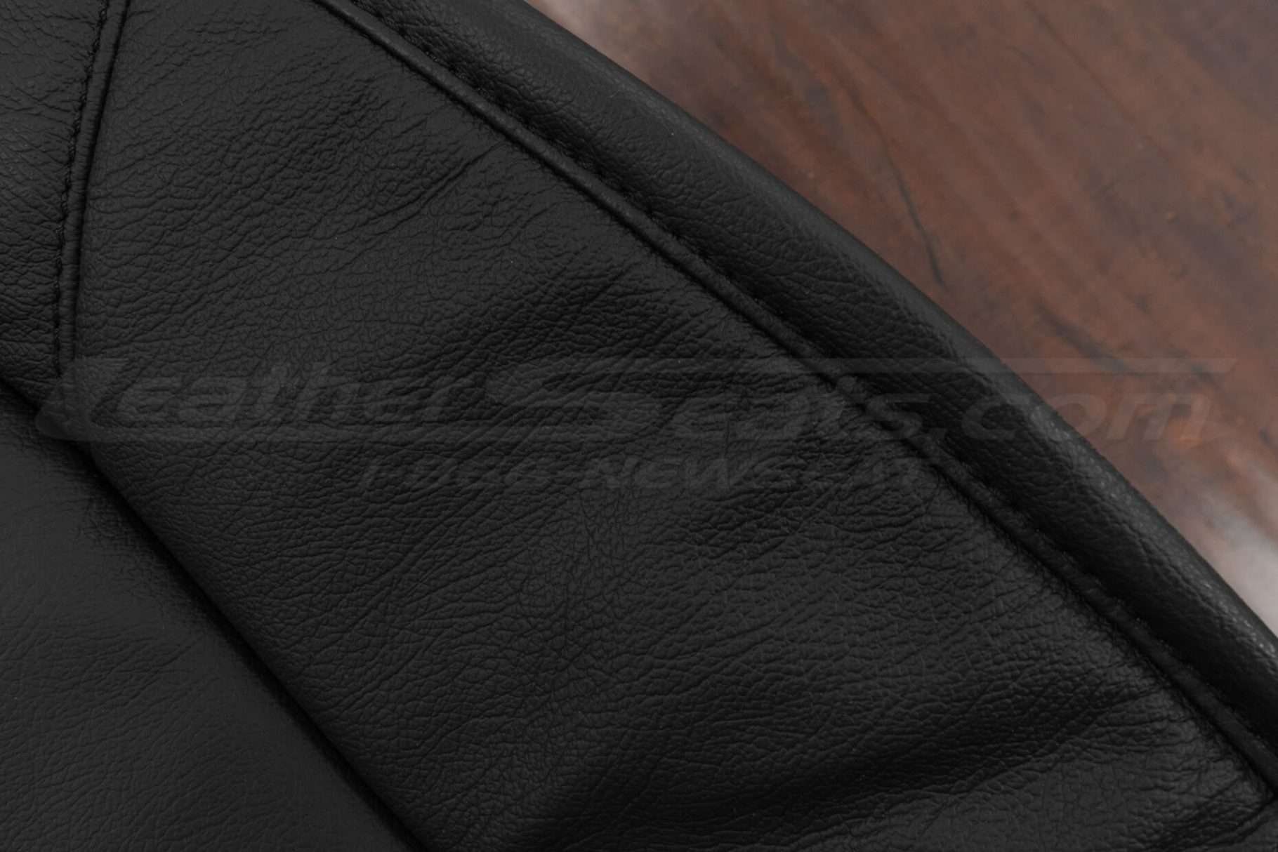 Black single-stitching on black leather