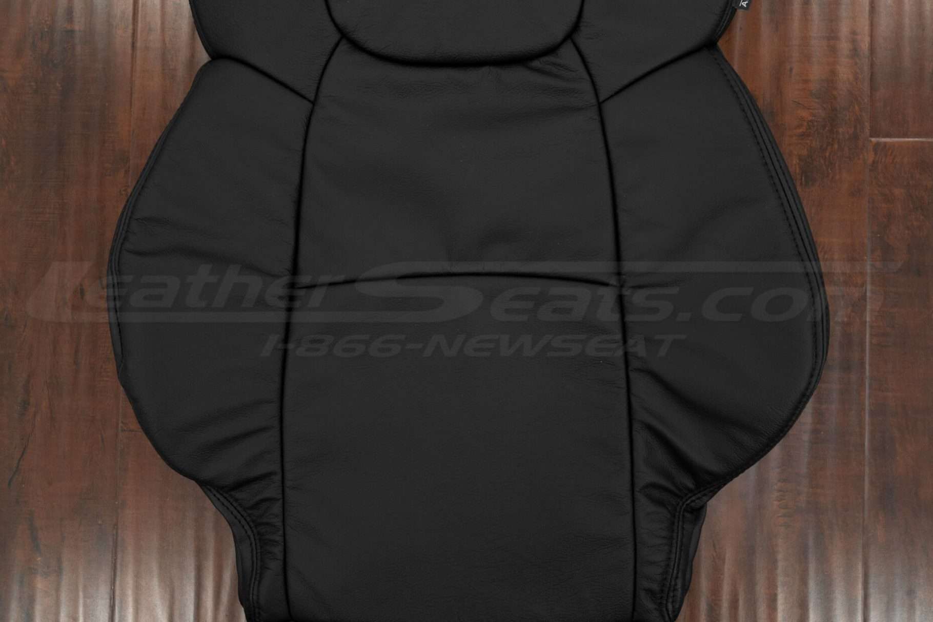 Black leather insert section of backrest upholstery