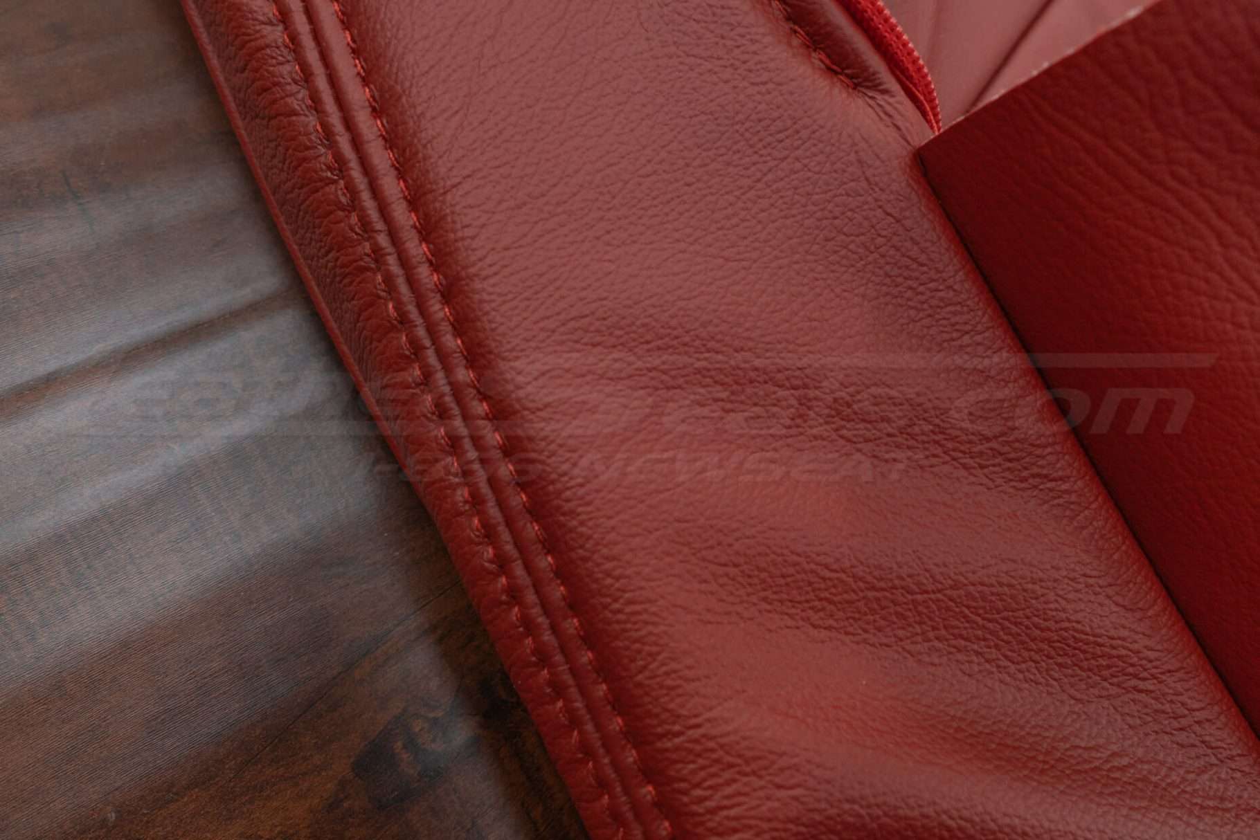 Cardinal double-stitching on cardinal leather