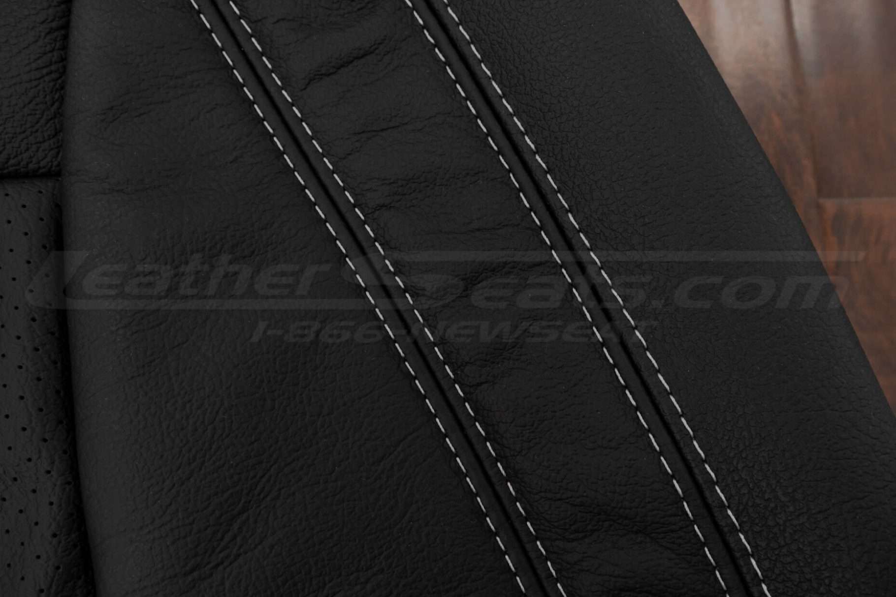 Contrasting Silver thread on Black leather