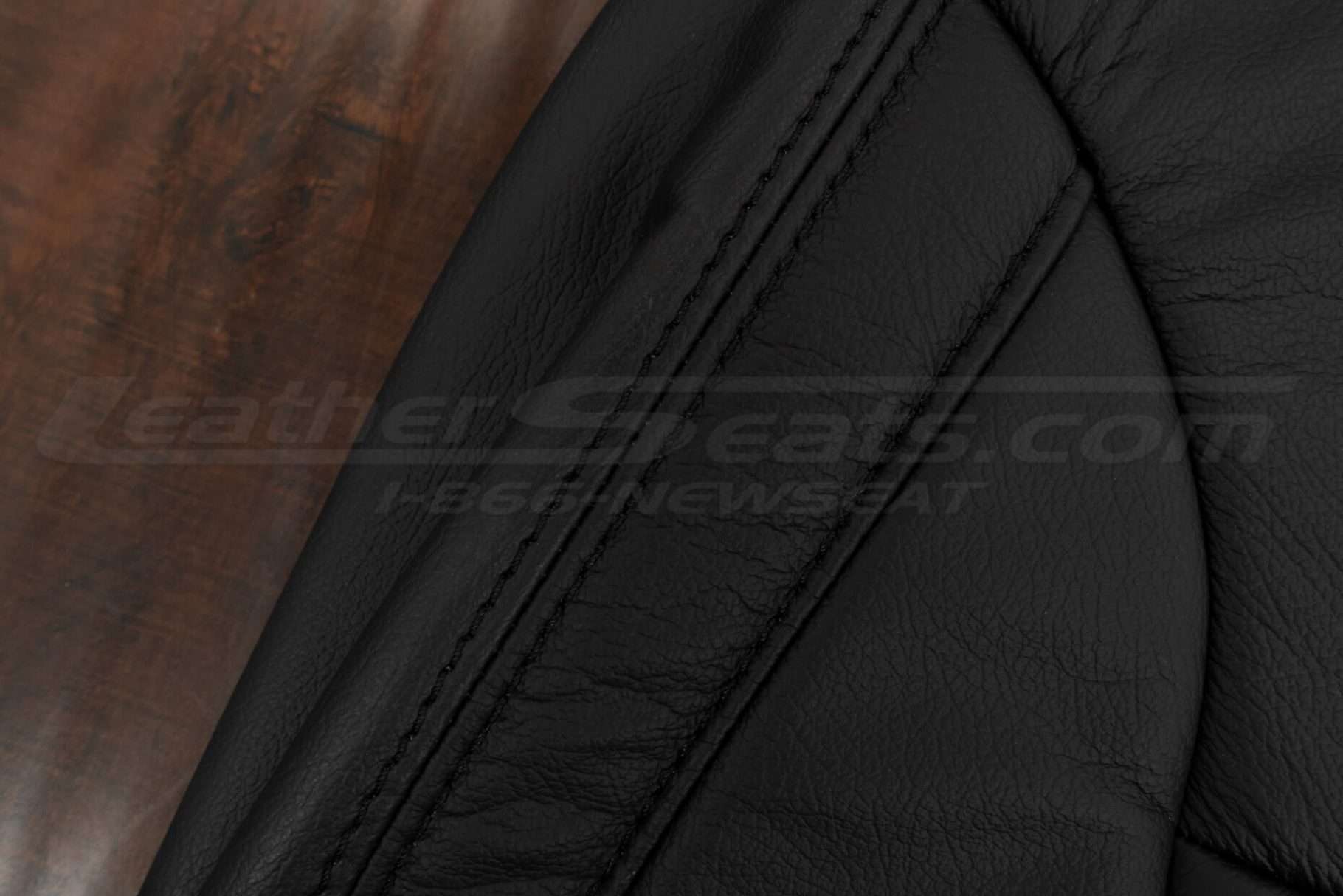 Matching Black double-stitching on Black leather