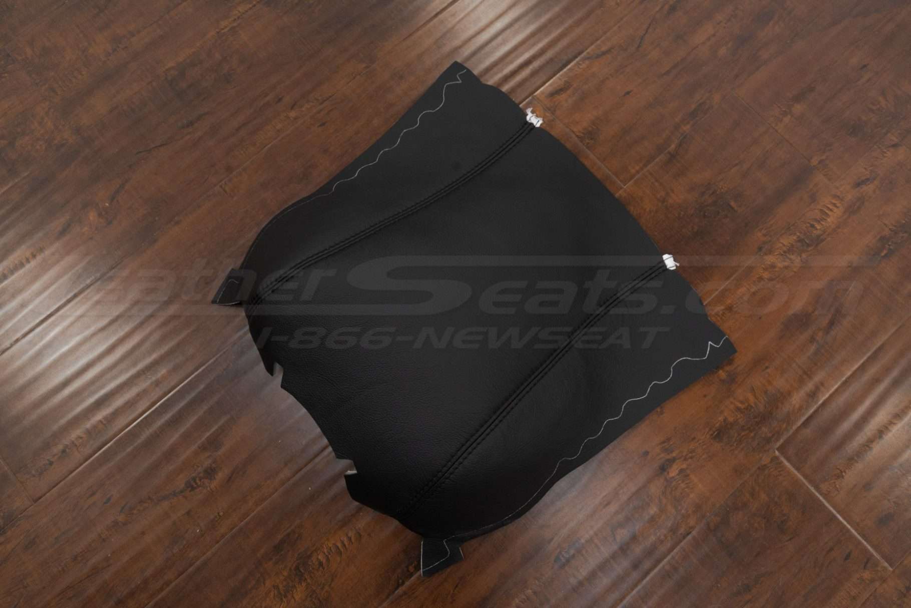 Top down side view of leather console lid cover upholstery