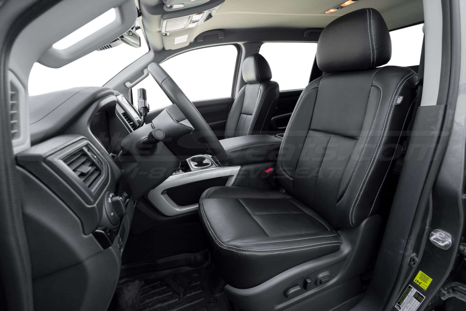 2021 Nissan Titan XD with custom black leather seats and silver stitching