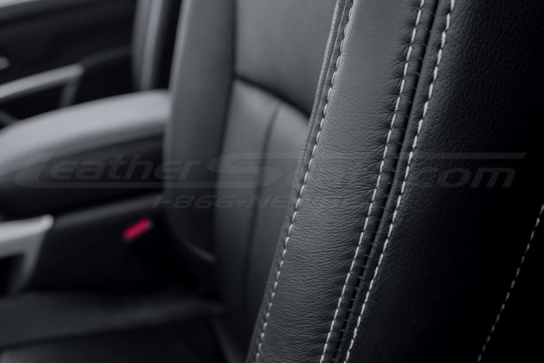 Contrasting silver double-stitching on Black leather