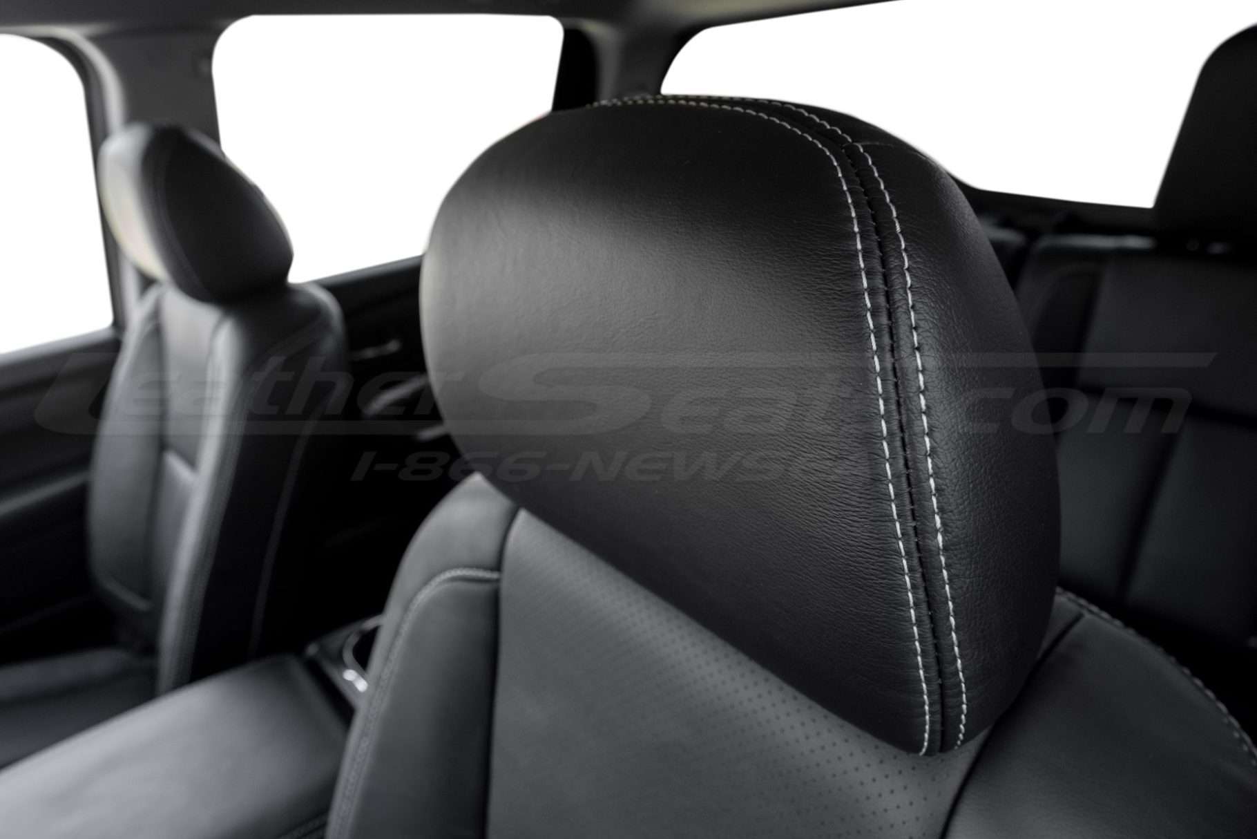 Silver stitching on Black leather headrest