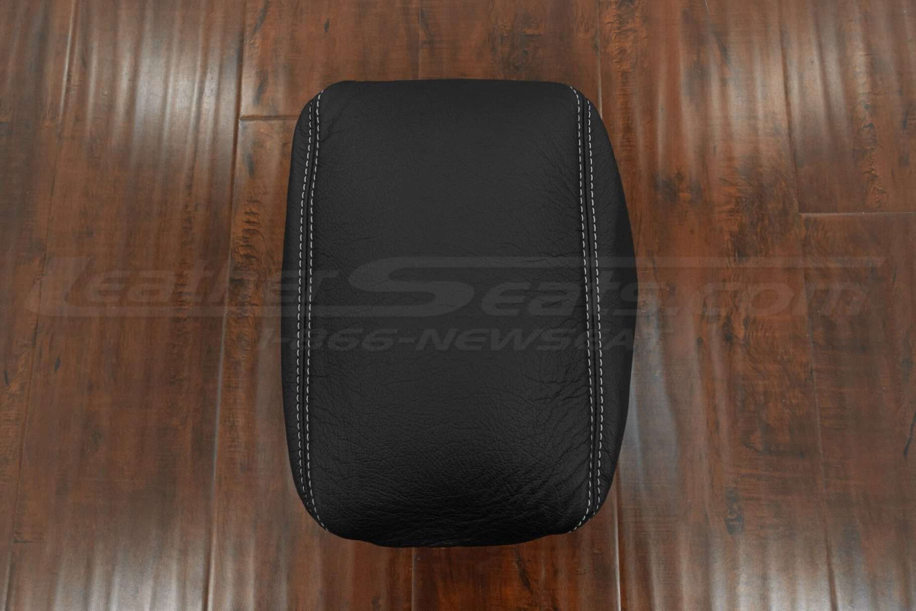Top-down flat view of black console lid cover upholstery
