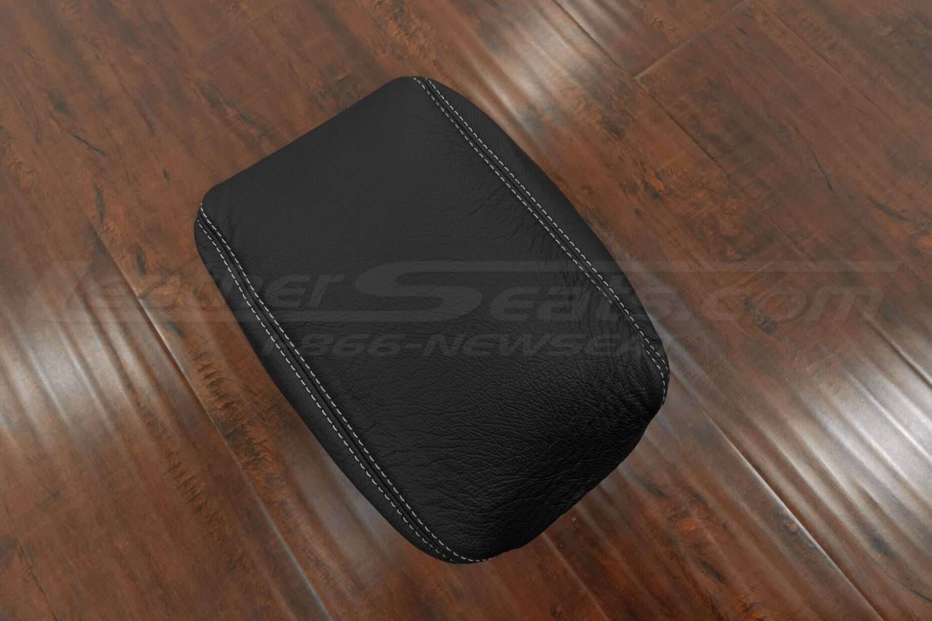 Top-down side view of jeep wrangler console lid cover uphosltery