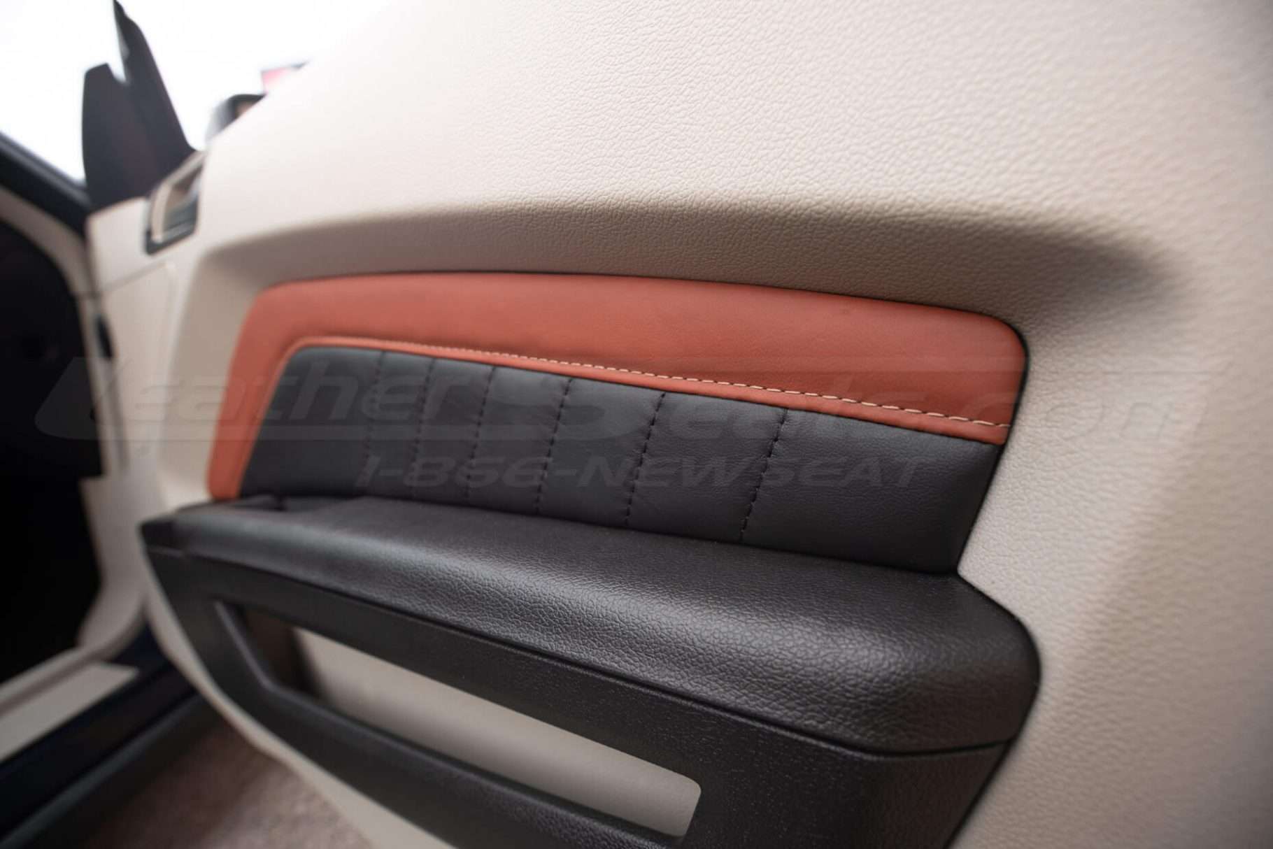 Leather door panel insert in Ecstasy Mitt Brown and Ecstasy Black leather