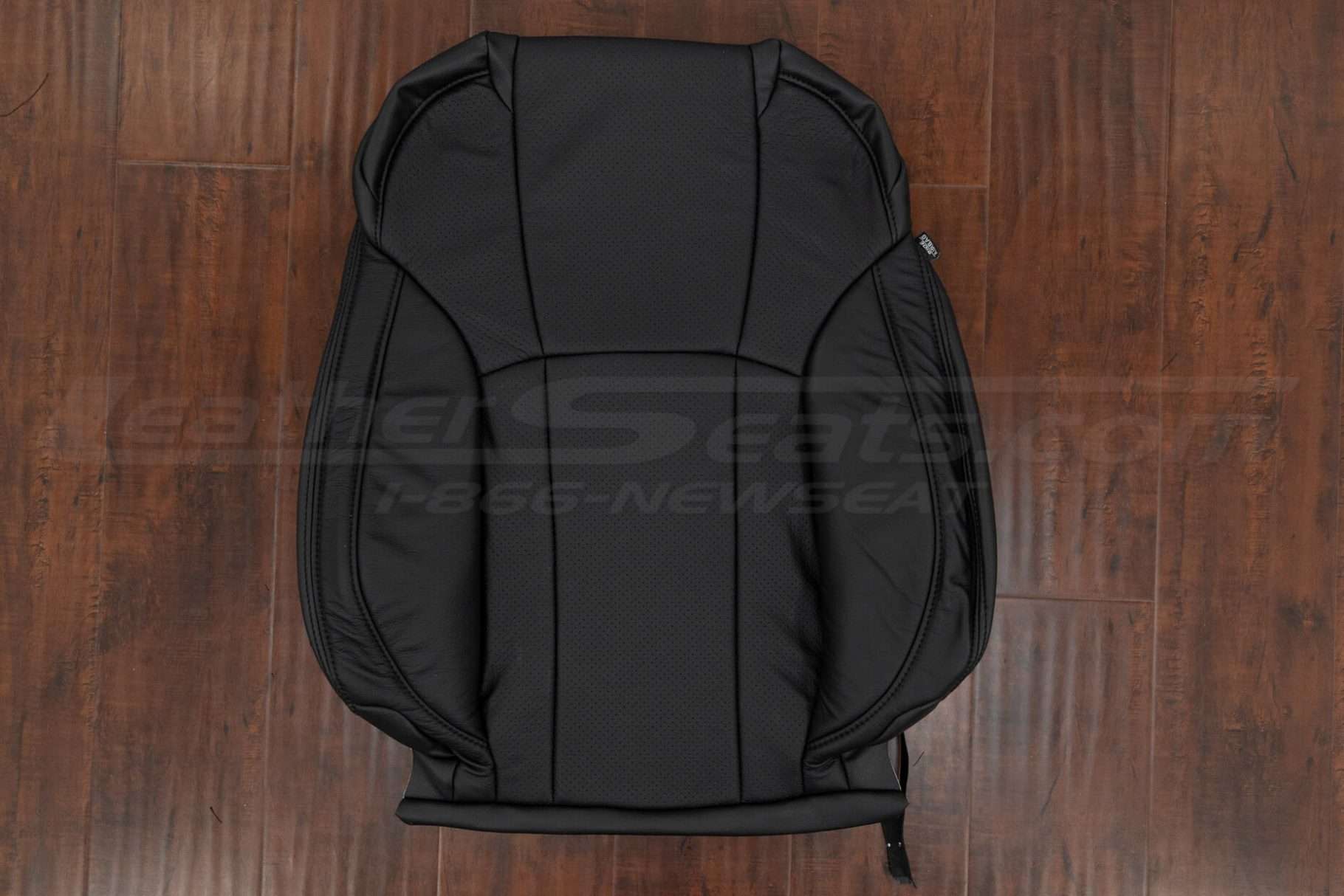 Black leather backrest uphosltery with perforated body section