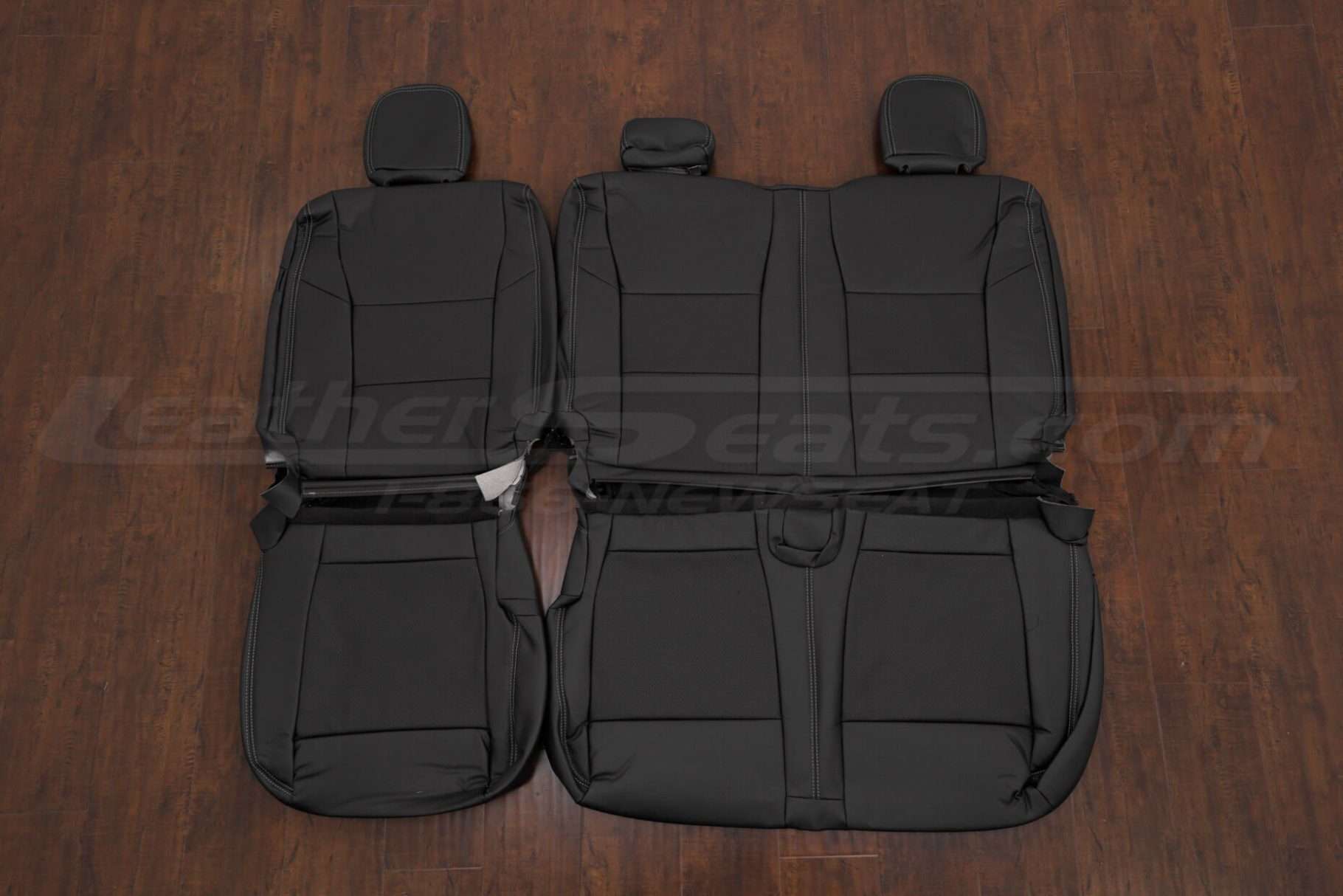 Rear seat upholstery with perforated inserts for Ford Superdty
