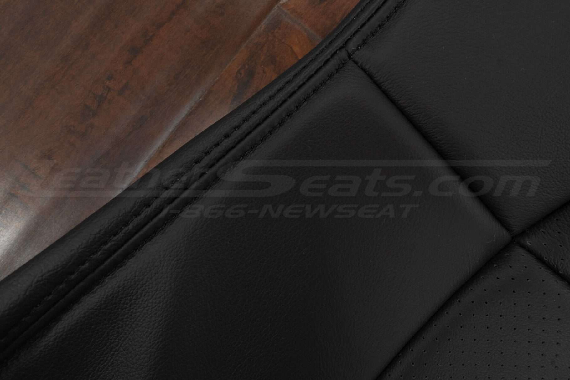 Black double-stitching on Black leather
