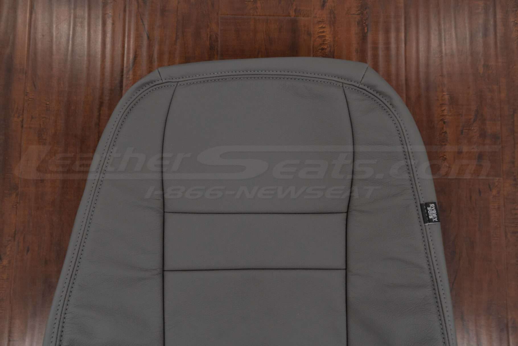 Upper section of leather backrest upholstery