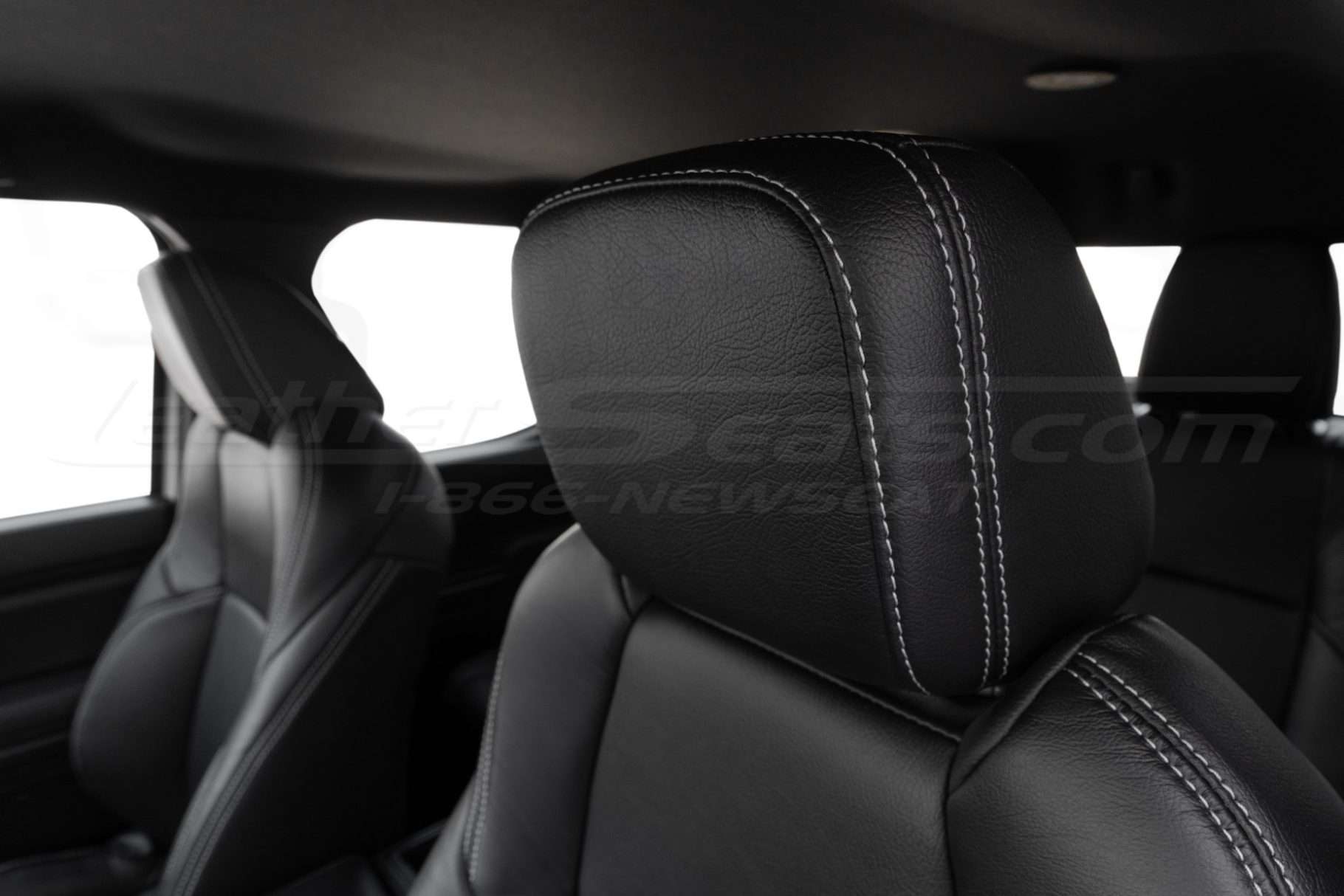 Toyota tacoma black leather headrest cover with contrast stitching