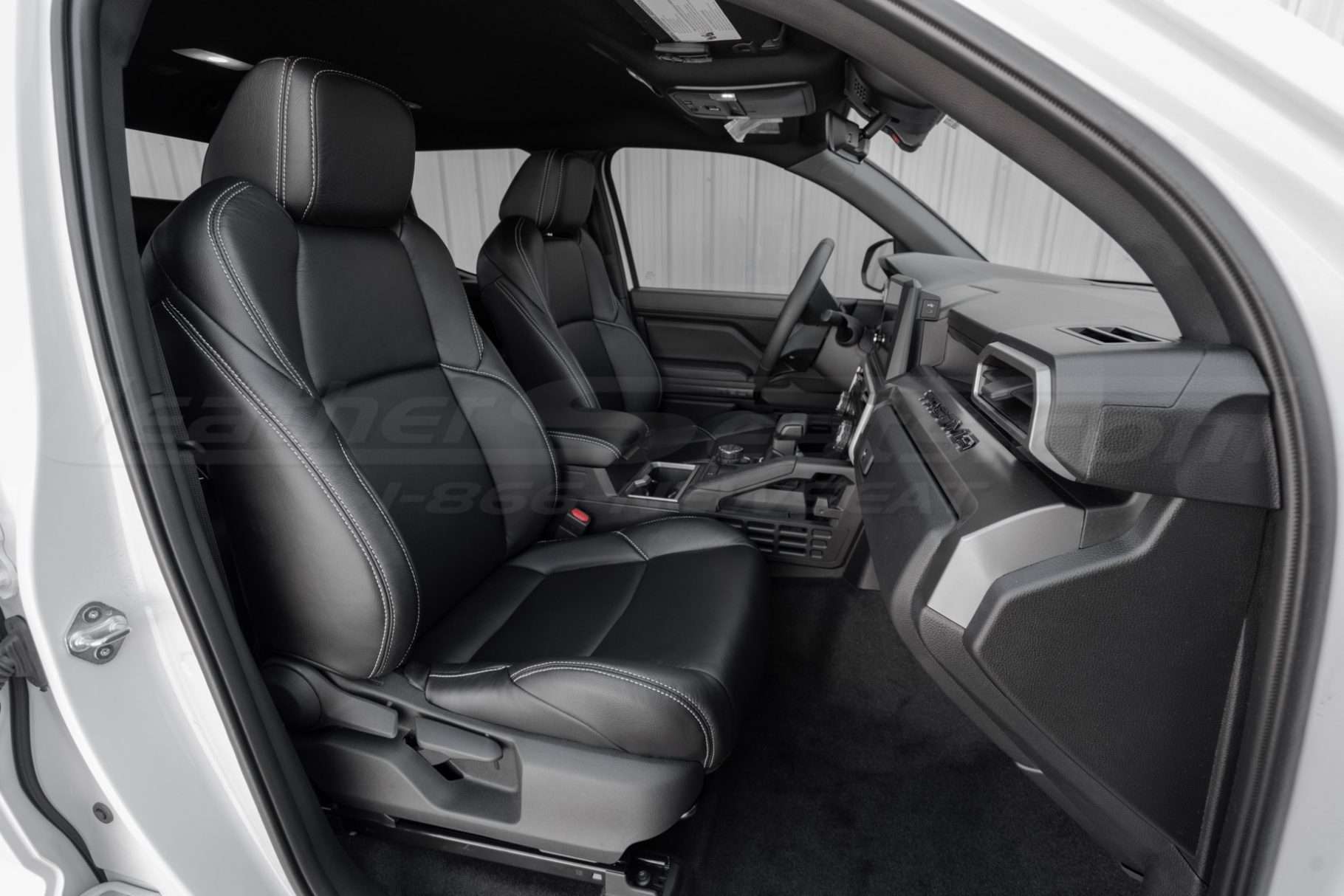 4th generation toyota tacoma with installed black leather seat covers