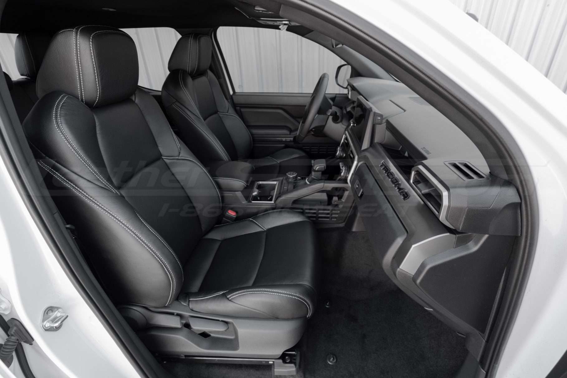 2024-2025 Toyota Tacoma custom leather seat covers in black with white/silver stitching