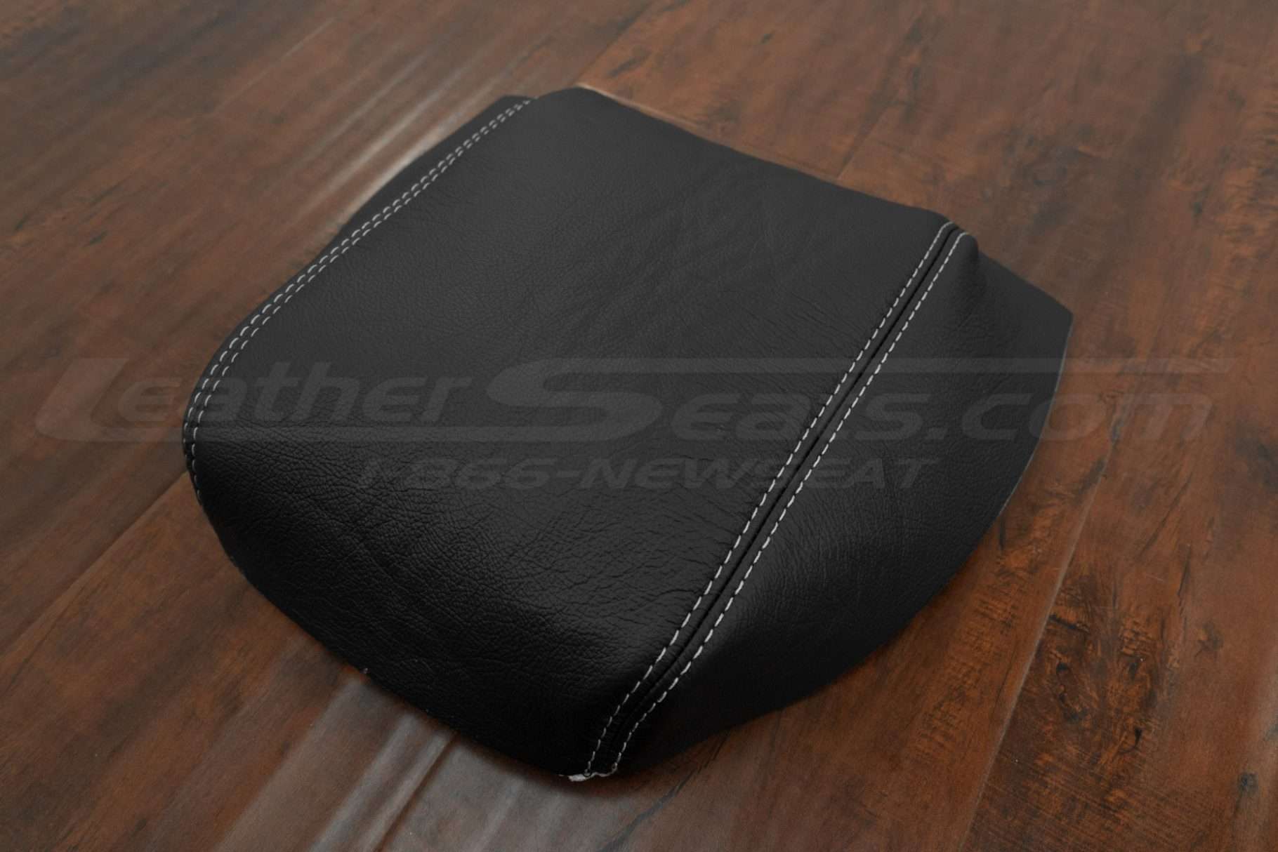 Flat lay side view of black leather console lid cover with dove gre contrasting stitching