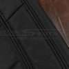 Black stitching on black leather backrest