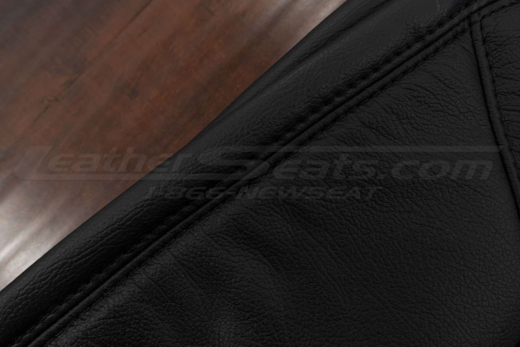 Black double-stitching on matching Black leather