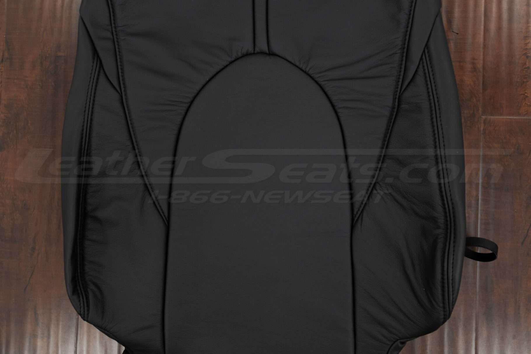 Black insert section of leather backrest upholsteru