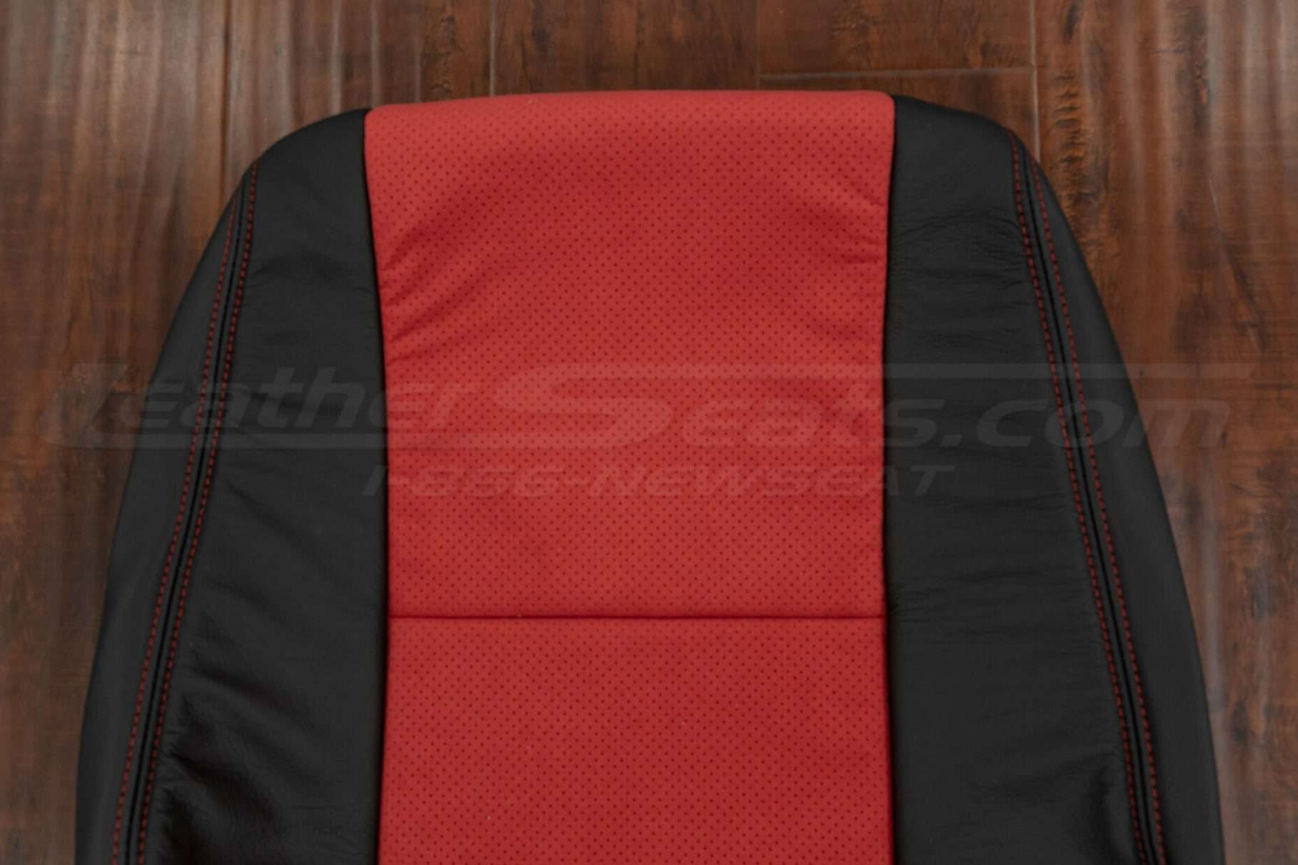 Upper section of perforated red suede backrest