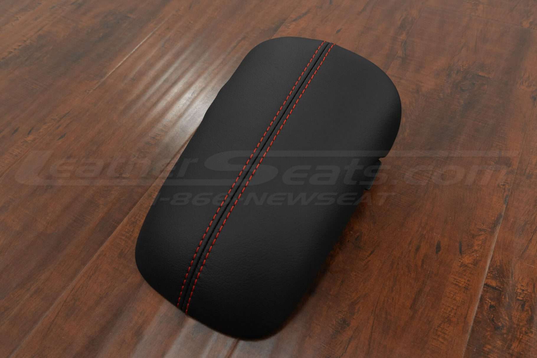 Side view of fFord Mustang GT leather console lid in black with bright red stitching