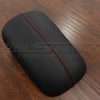 Ford Mustang leather console lid in Black with bright red stitching