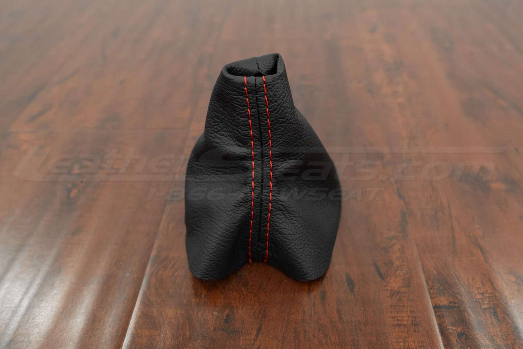 Front view of black shift boot upholstery with bright red stitching